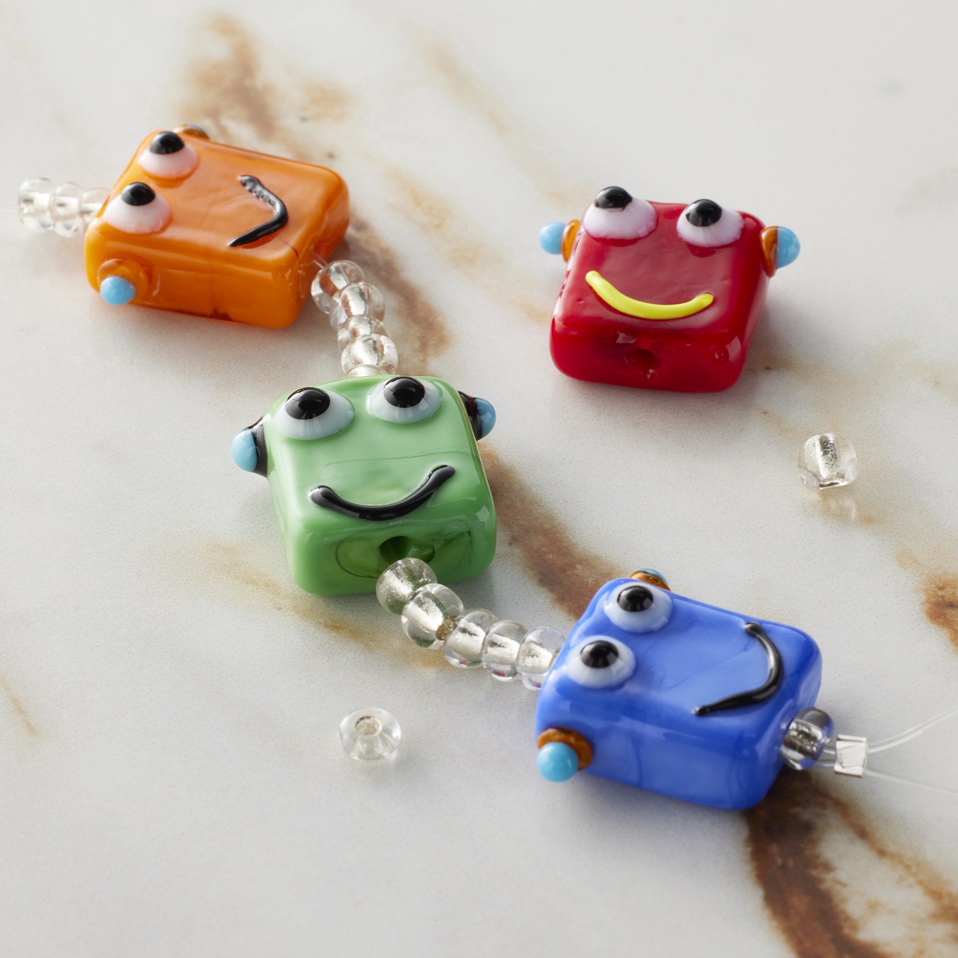 slide 3 of 3, Multicolor Lampwork Glass Robot Beads By Bead Landing, 17mm x 19mm