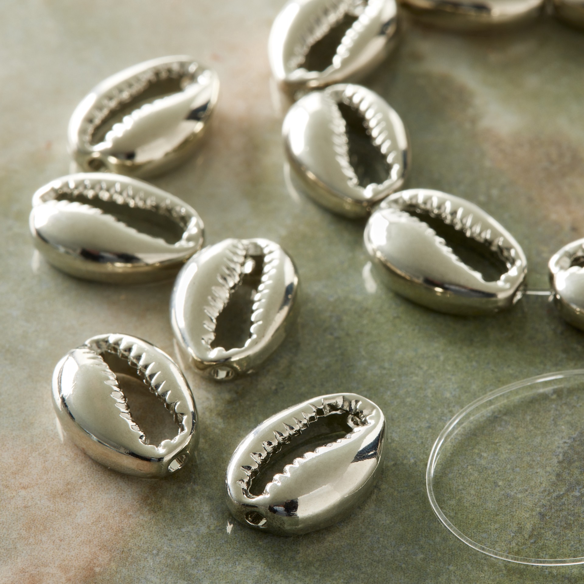 slide 3 of 3, Rhodium Zinc Alloy Cowry Shell Beads, 17mm By Bead Landing, 17mm