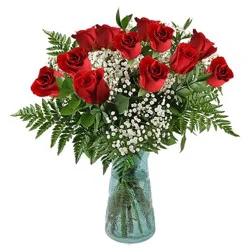 One Dozen Rose Arrangement With Babies Breath & Greens In A Vase