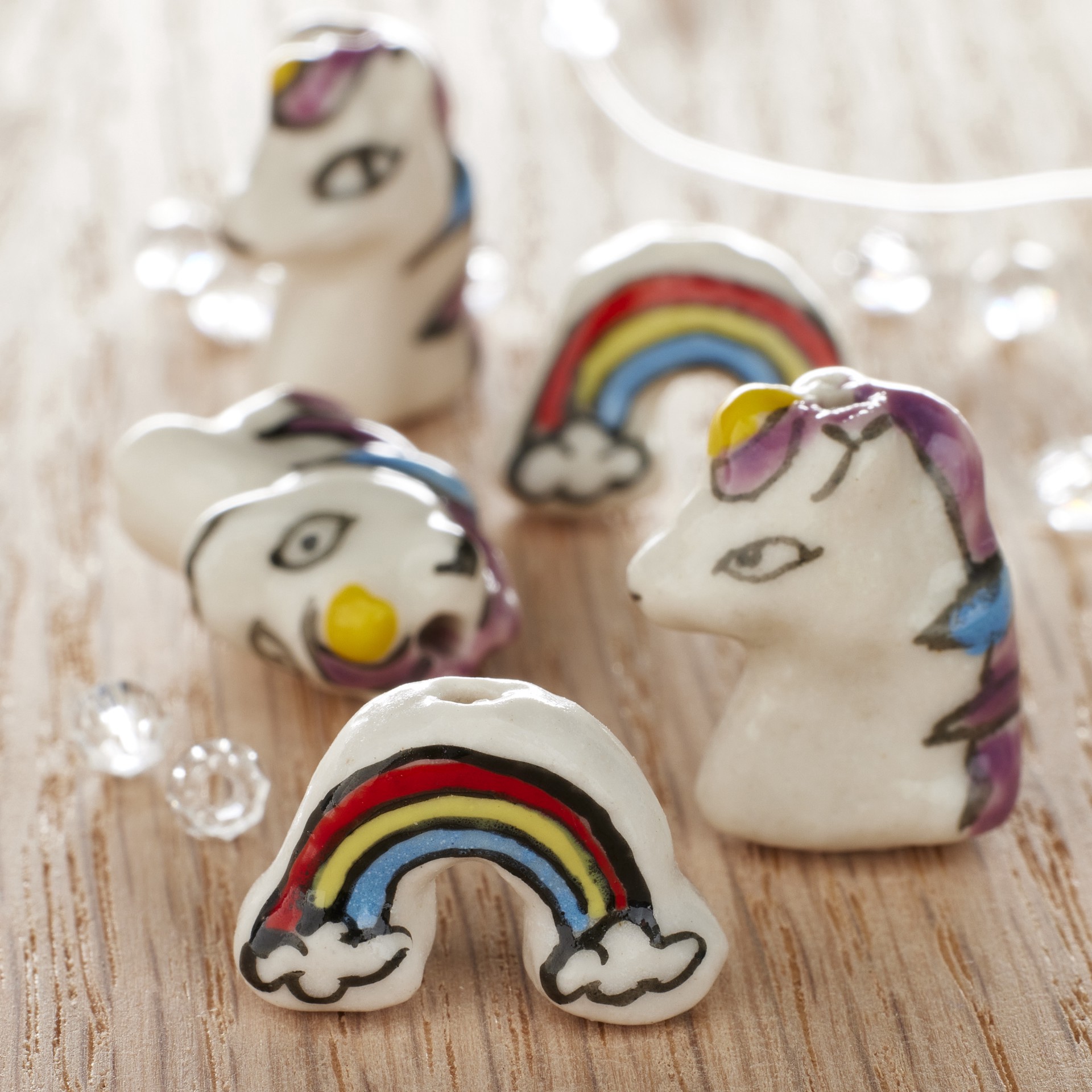 slide 2 of 3, Multicolor Ceramic Unicorn & Rainbow Beads By Bead Landing, 12mm-18mm