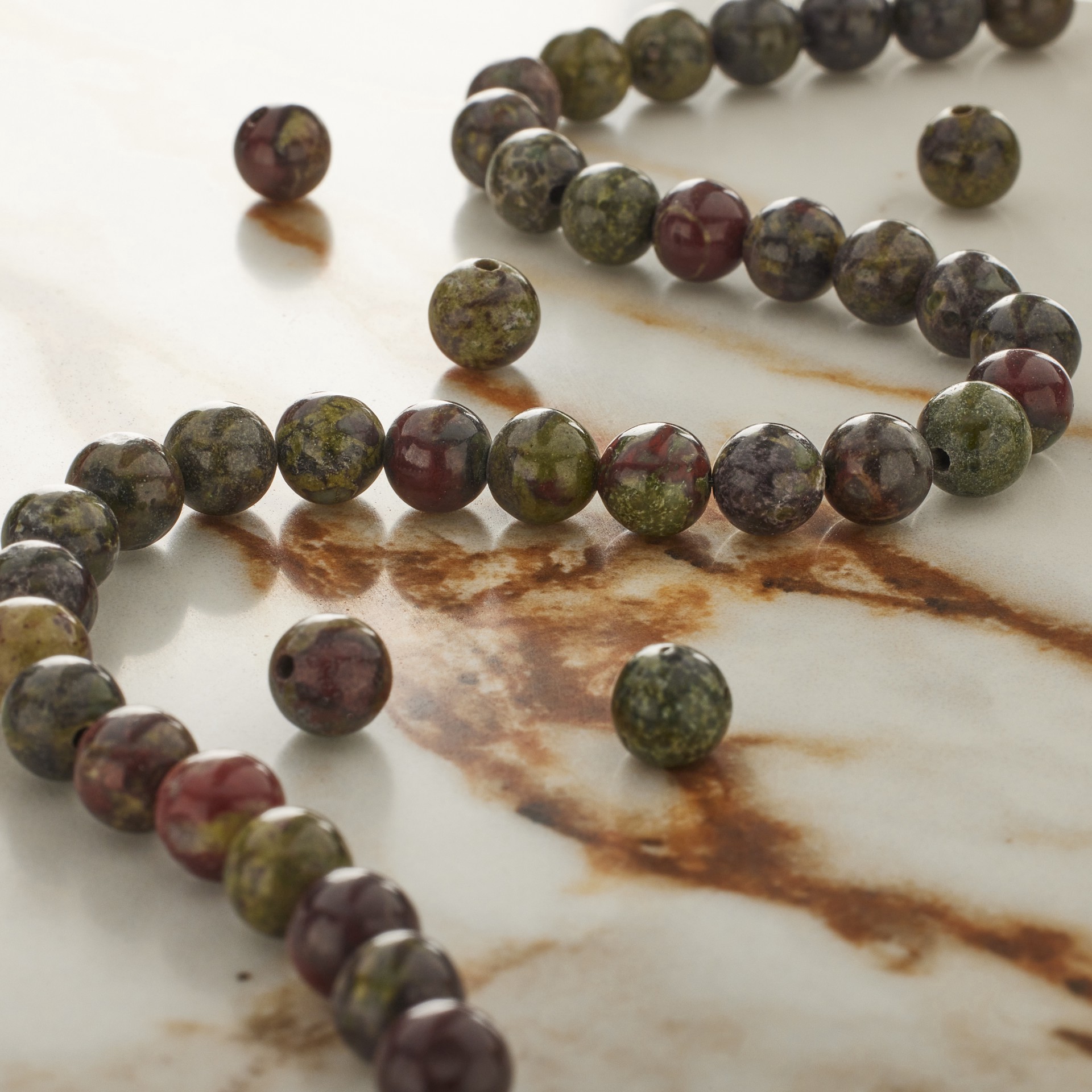 slide 2 of 3, Dark Green & Red Dragon Blood Round Beads By Bead Landing, 6 mm