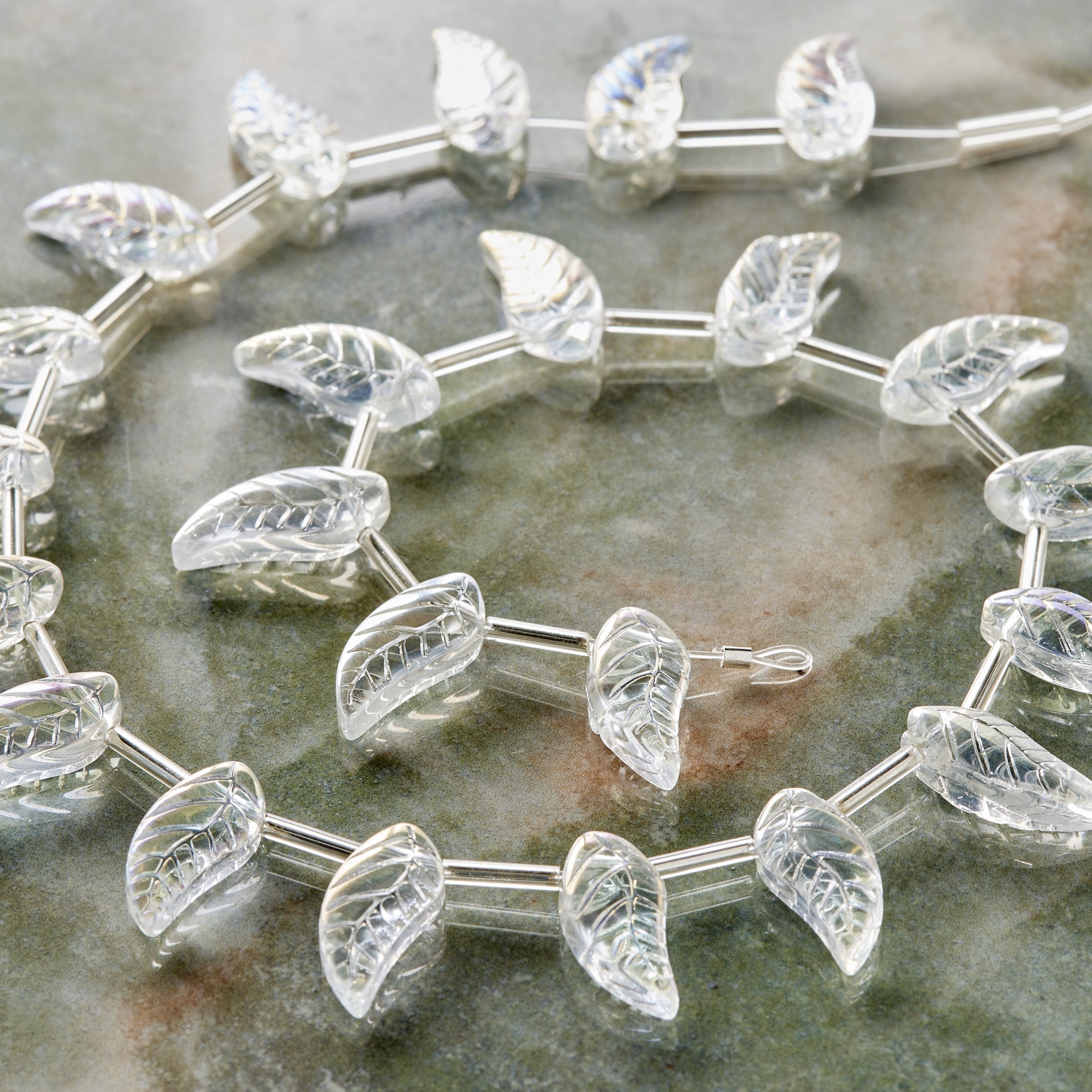 slide 2 of 3, Clear Aurora Borealis Glass Leaf Beads, 17mm By Bead Landing, 17mm