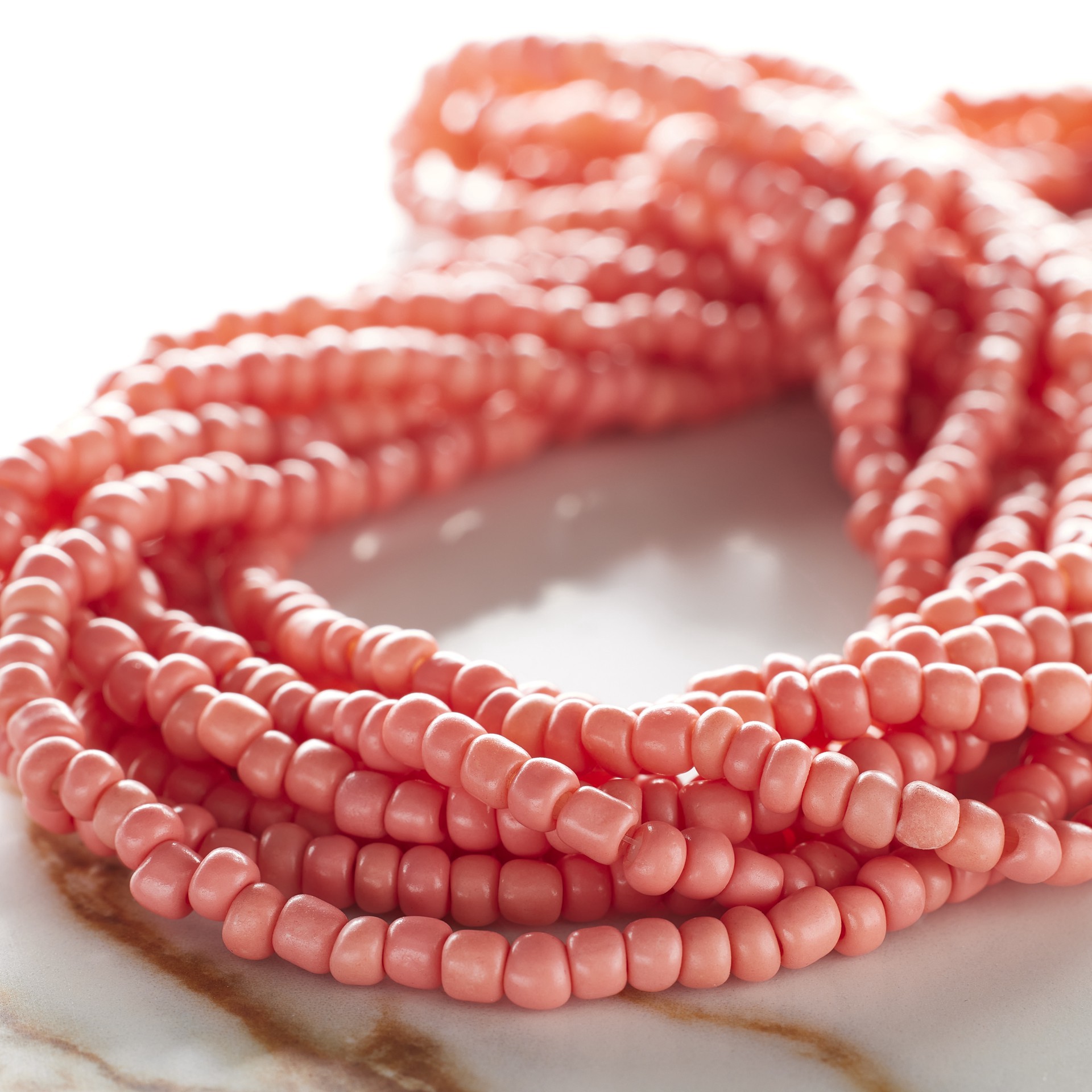 slide 2 of 3, Coral Glass Medium Rondelle Seed Beads, 6/0 By Bead Landing, 6/0