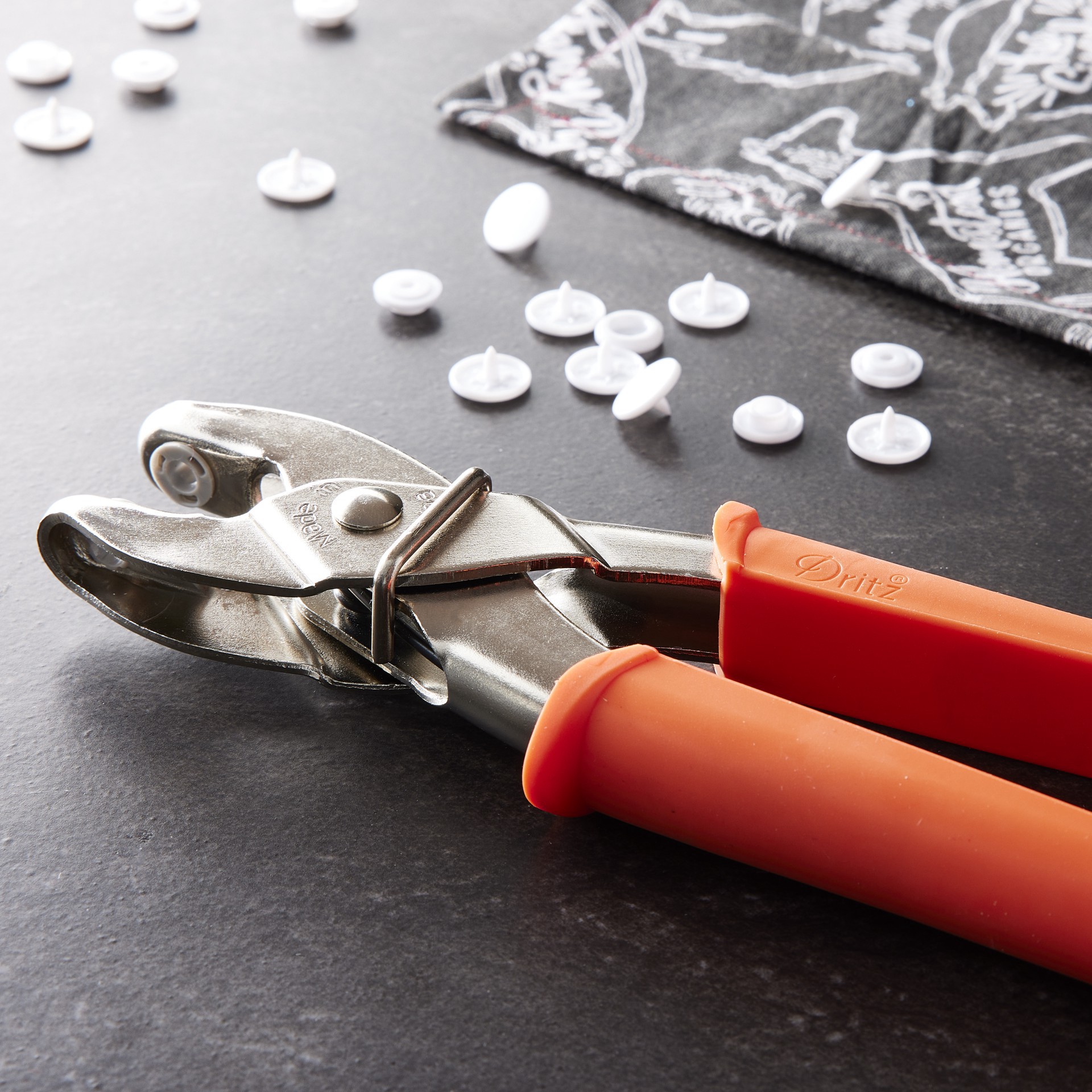 slide 6 of 7, Dritz Plastic Snap Pliers, applies size 20 snaps