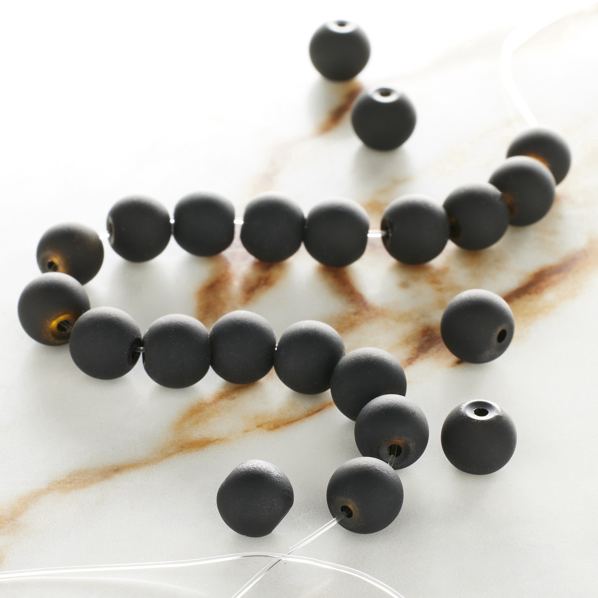 slide 3 of 3, 8mm Black Round Rubber Coated Glass Beads By Bead Landing, 8mm