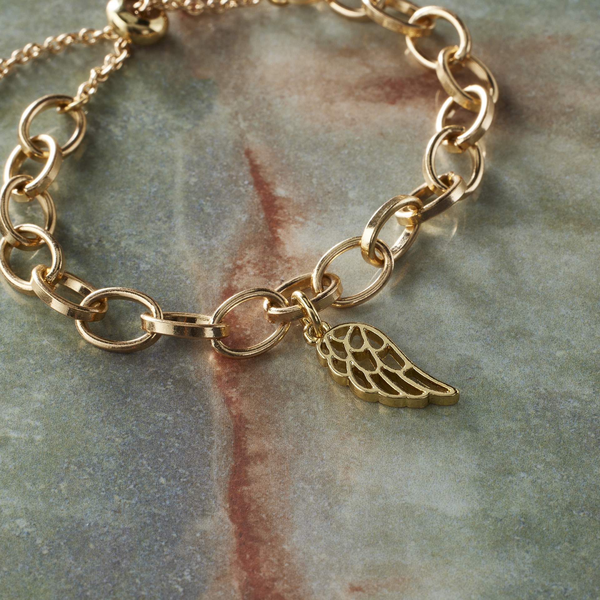slide 4 of 6, 14k Gold Plated Wing Charm By Bead Landing, 0.97 in x 0.34 in x 0.24 in