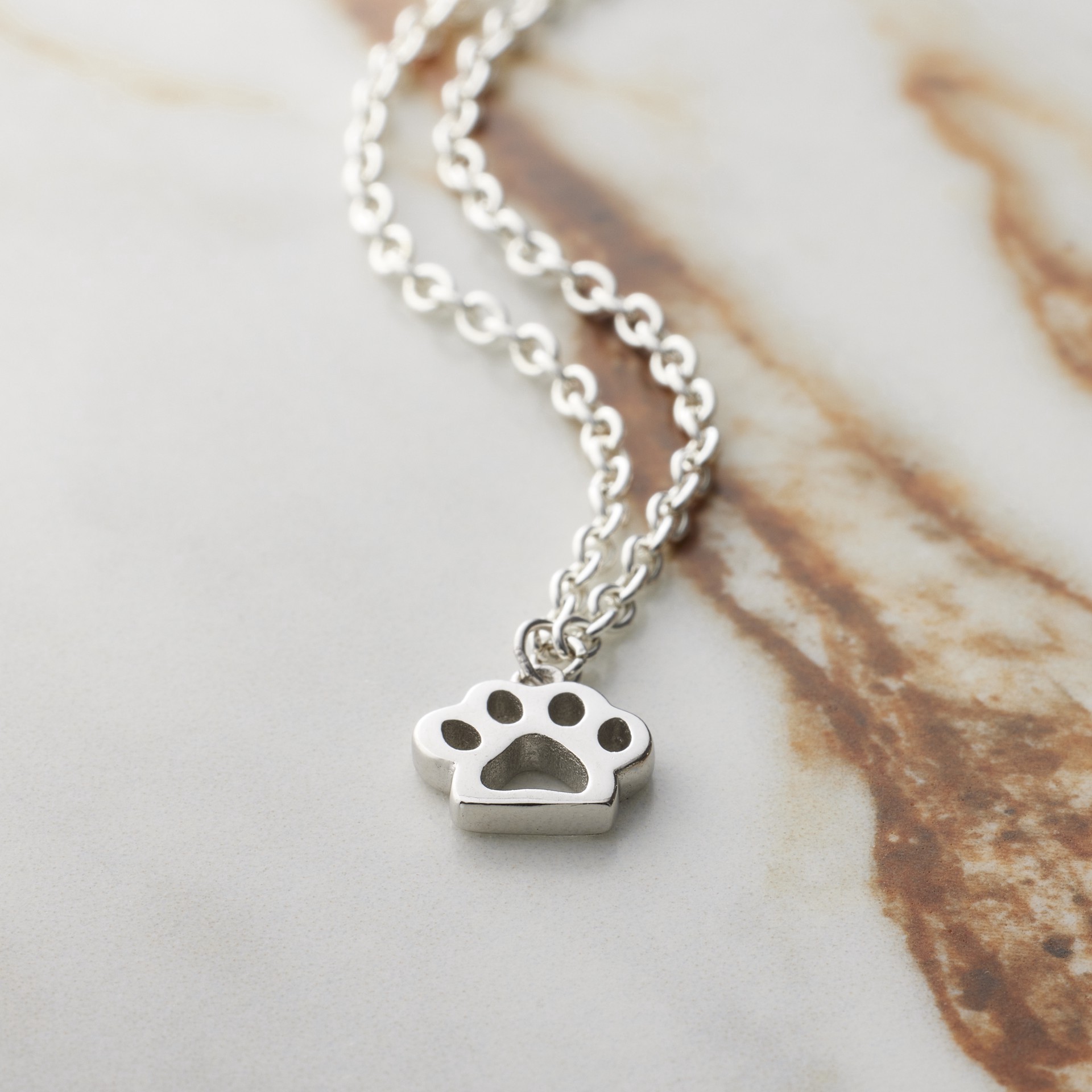 slide 3 of 7, Sterling Silver Paw Icon Charm By Bead Landing, 0.43 in x 0.38 in x 0.07 in