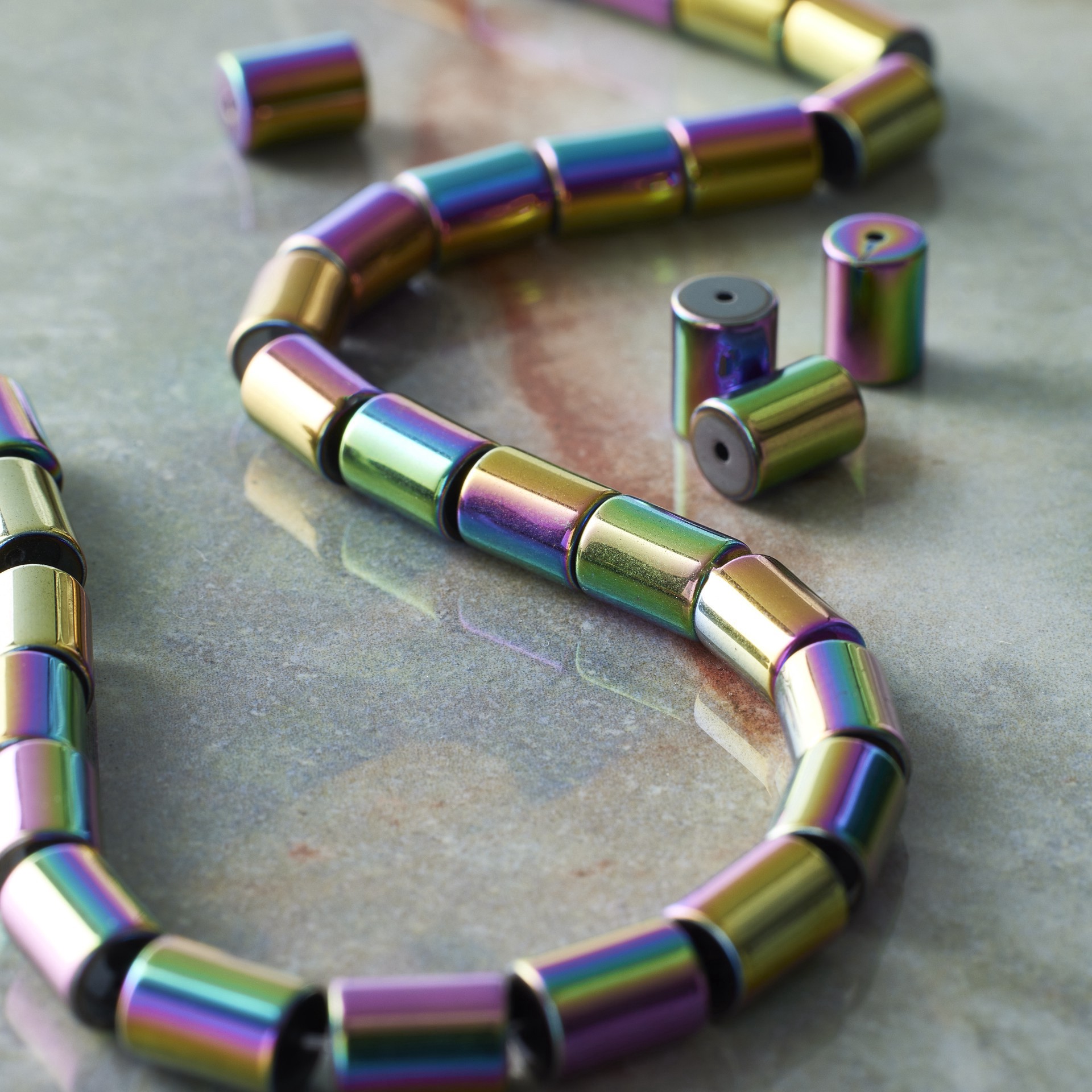 slide 2 of 3, Rainbow Reconstituted Hematite Tube Beads, 8mm By Bead Landing, 8mm