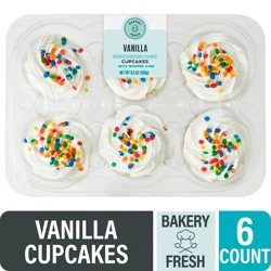 Bakery Fresh Vanilla Cupcakes With White Whipped Icing
