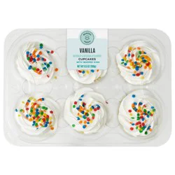 Bakery Fresh Vanilla Cupcakes With White Whipped Icing