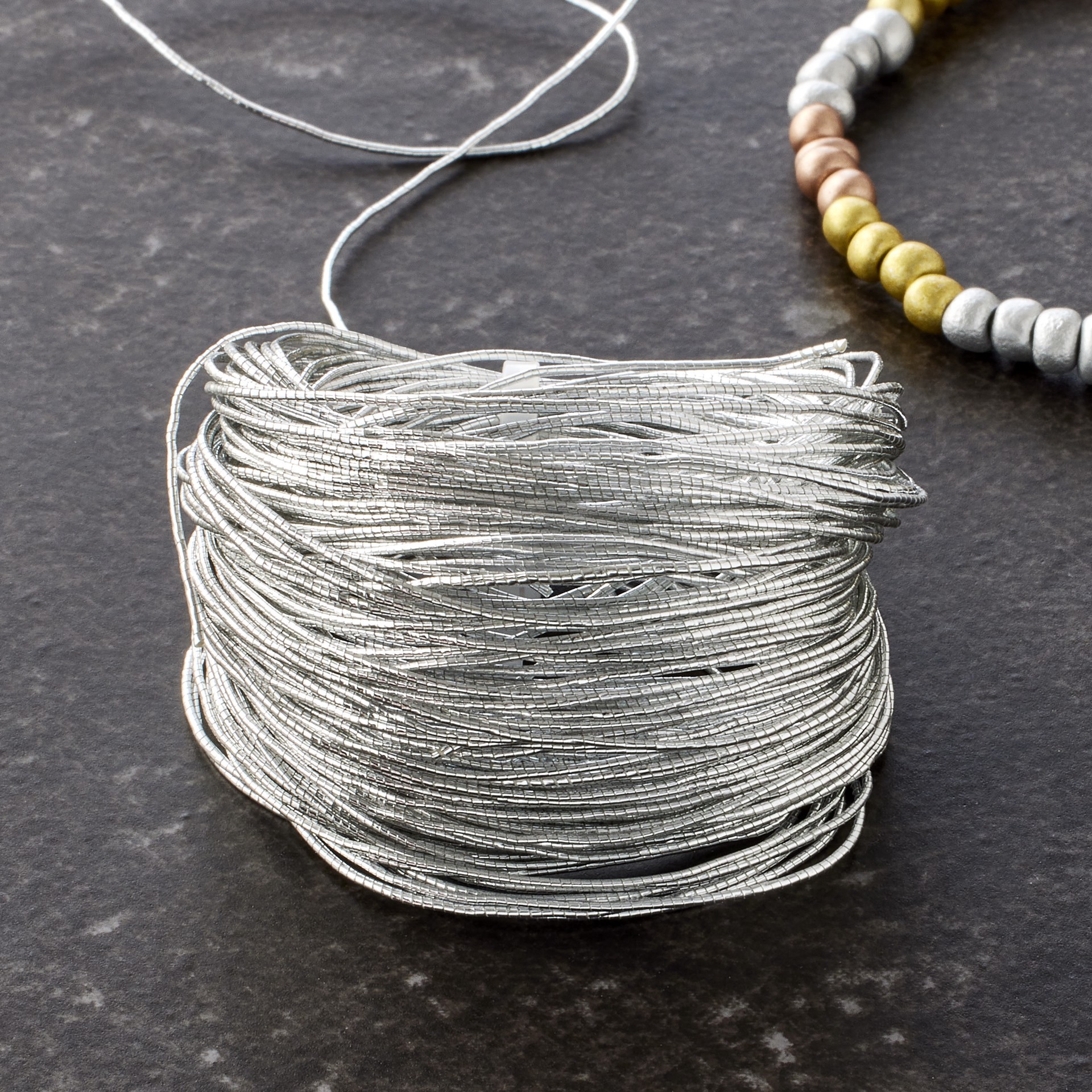 slide 2 of 2, 0.5mm Silver Elastic Cord By Bead Landing, 0.5mm