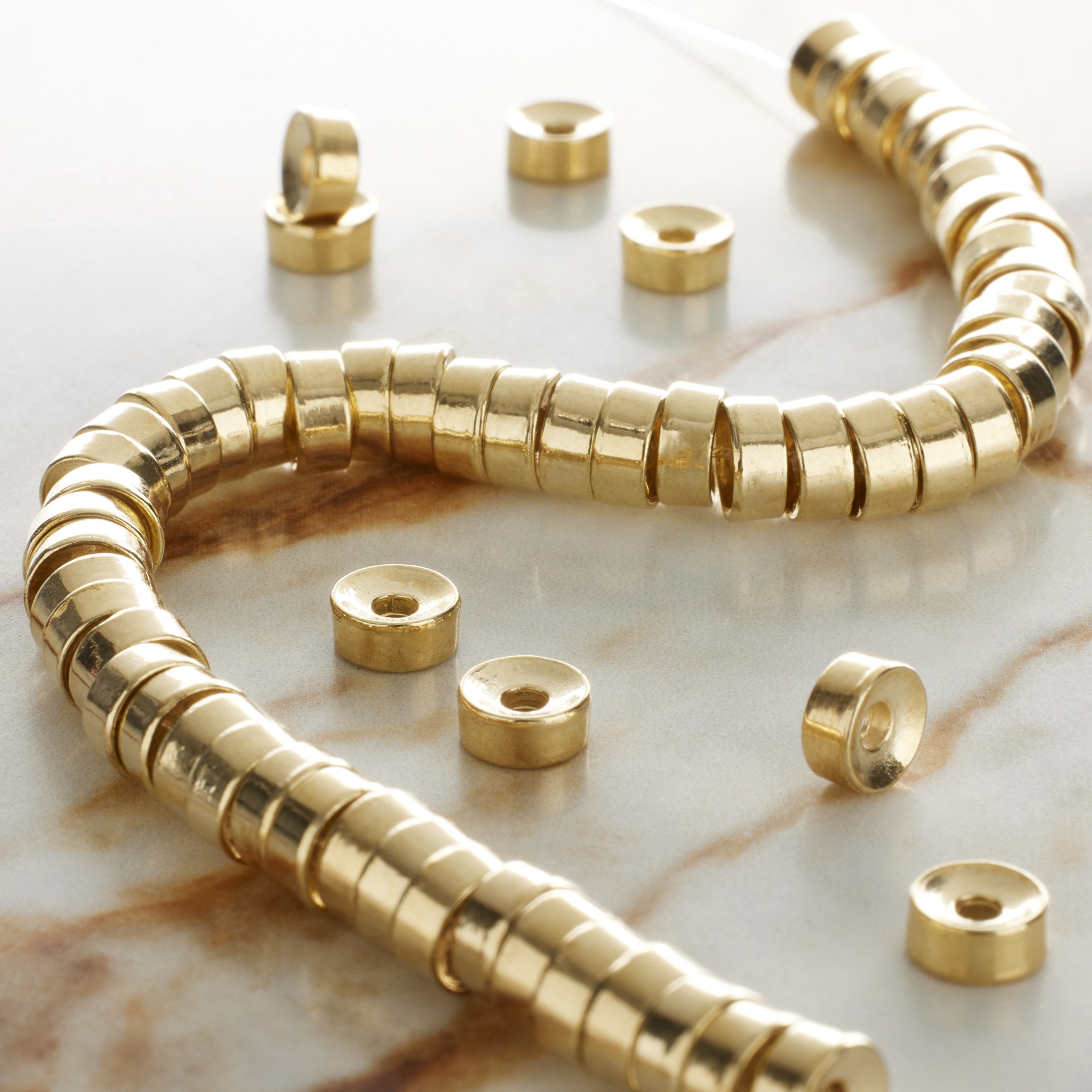 slide 2 of 3, Gold Metal Interlock Beads By Bead Landing, 8 mm