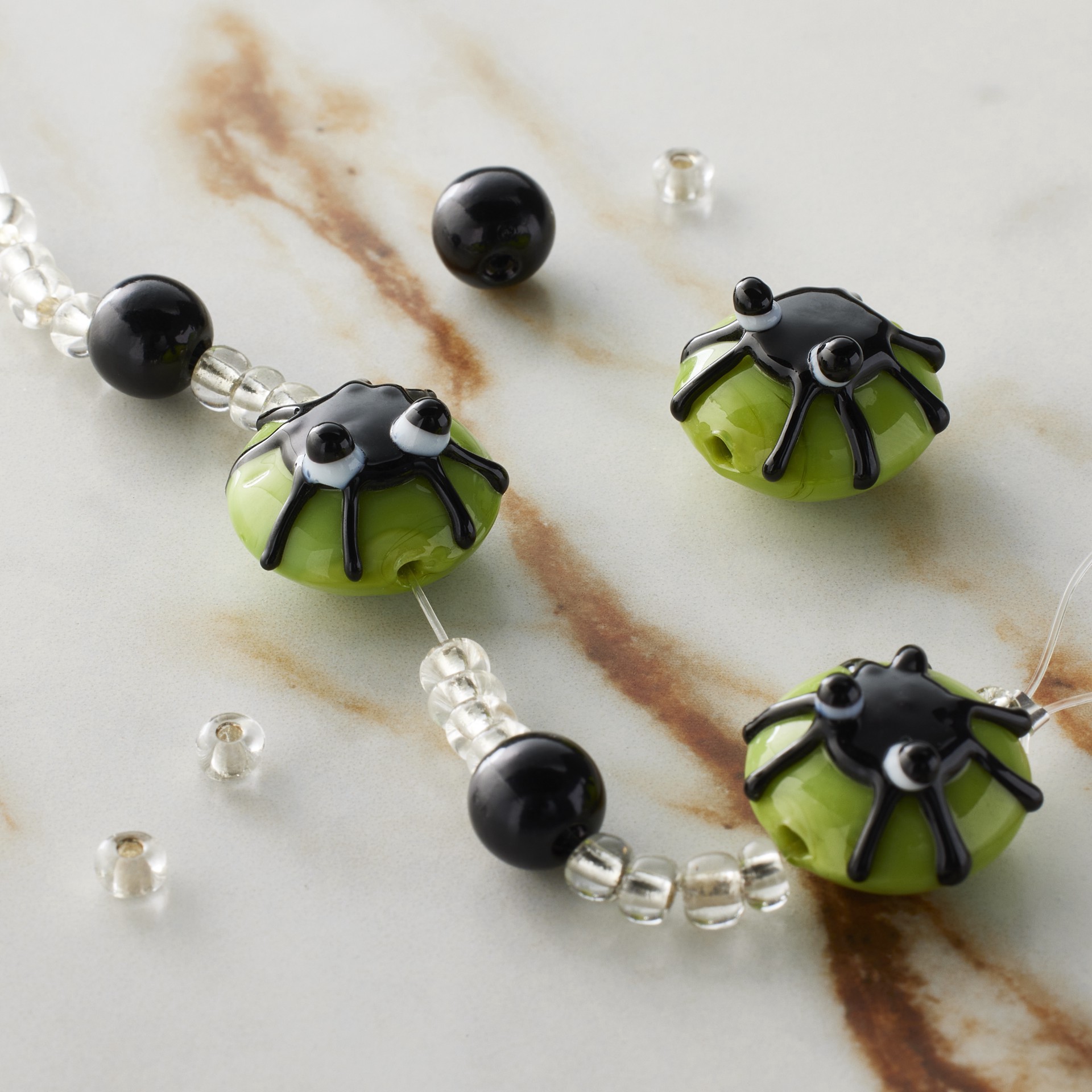 slide 2 of 3, Green & Black Spider Lampwork Glass Bead Mix By Bead Landing, 15mm to 16.5mm spider