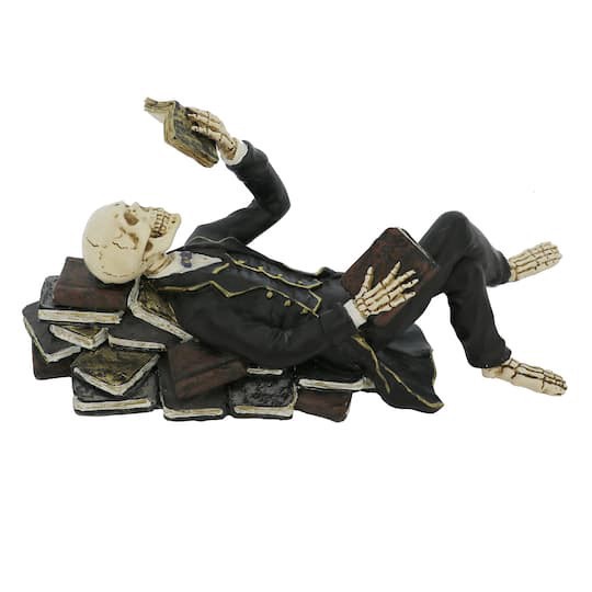 slide 1 of 4, 8" Lying Skeleton With Book Tabletop Decor By Ashland, 8 in